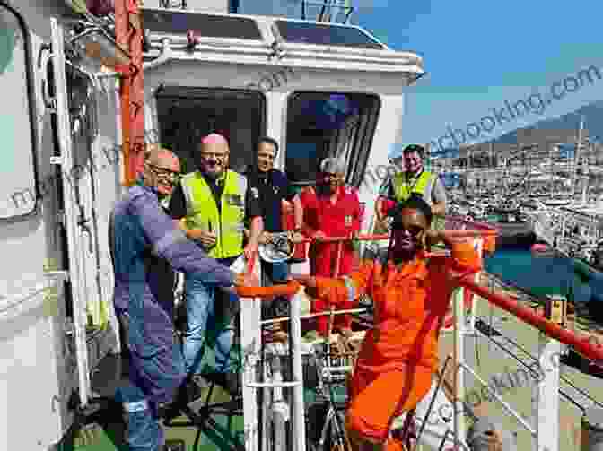 A Group Of Seafarers Pose For A Photo On The Deck Of A Ship, Smiling And Laughing. Paid To Live The Dream: A Seafarer S Tale Of Life Afloat