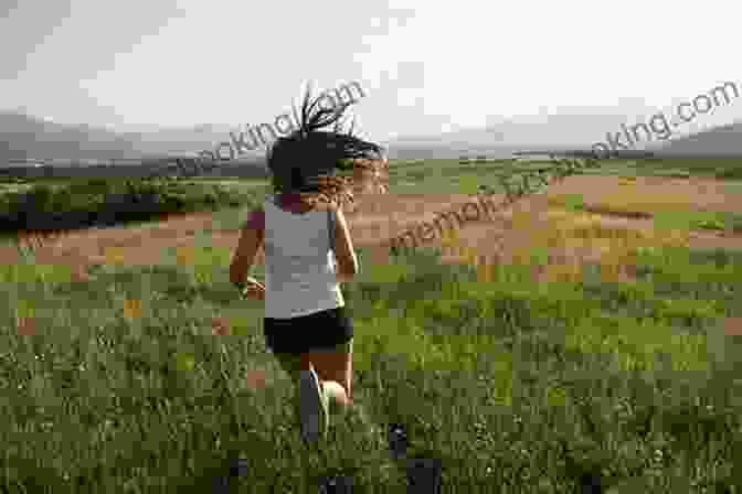A Young Woman Running Through A Field With Mountains In The Background Girl Running Annette Bay Pimentel